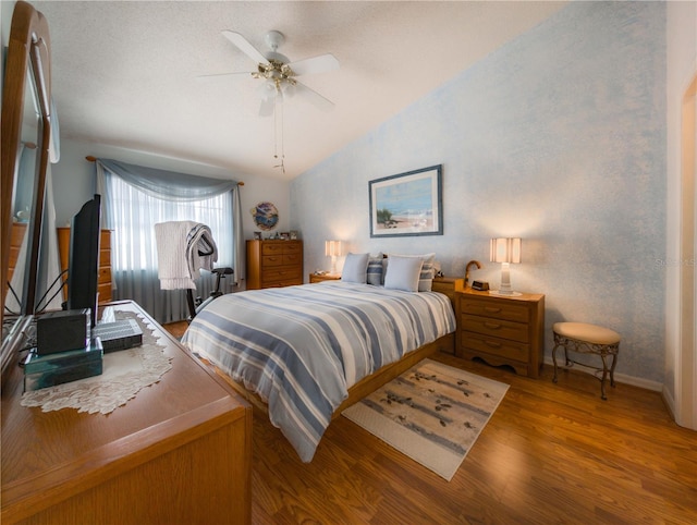 39650 US Highway 19 N, Tarpon Springs, FL 34689 - bedroom with lofted ceiling, wood finished floors, baseboards, and ceiling fan