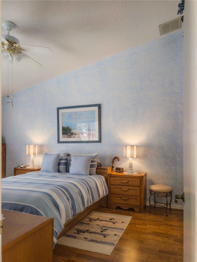 39650 US Highway 19 N, Tarpon Springs, FL 34689 - bedroom with wood finished floors, ceiling fan, and a textured ceiling