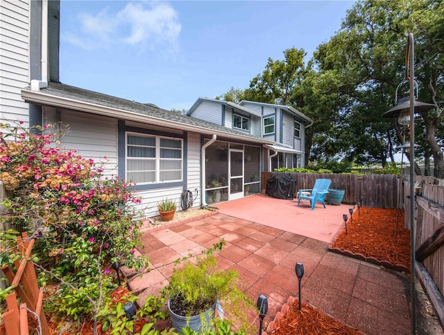 39650 US Highway 19 N, Tarpon Springs, FL 34689 - fenced backyard featuring a patio and a sunroom