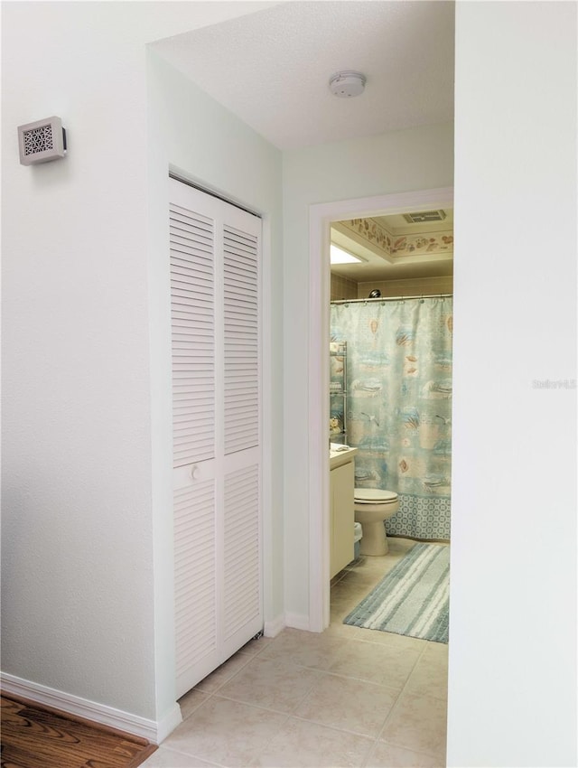 39650 US Highway 19 N, Tarpon Springs, FL 34689 - hall with light tile patterned flooring and baseboards