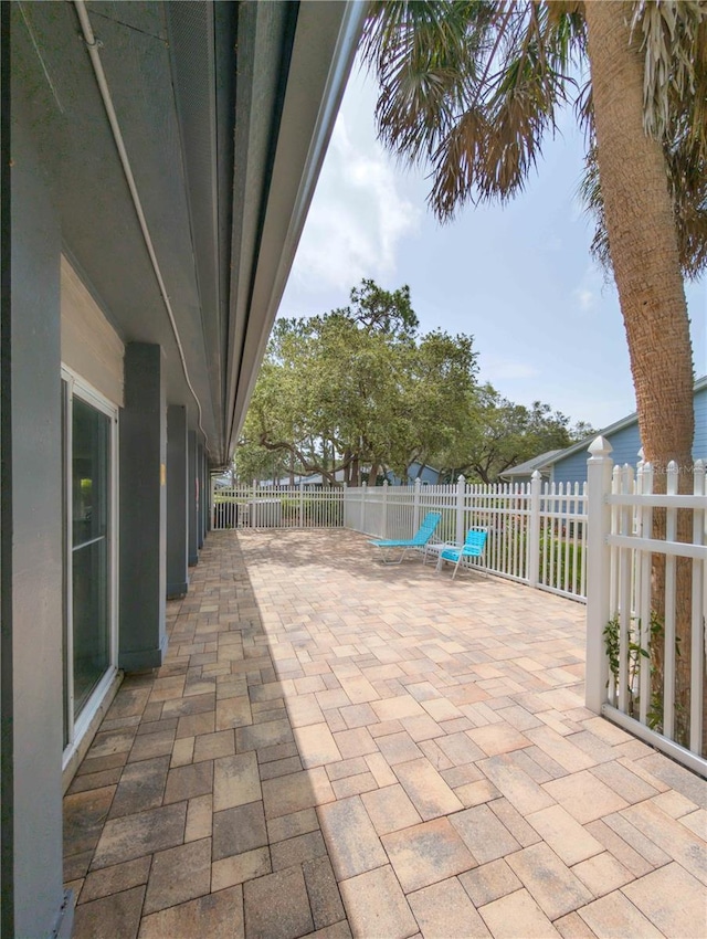 39650 US Highway 19 N, Tarpon Springs, FL 34689 - fenced backyard featuring a patio area