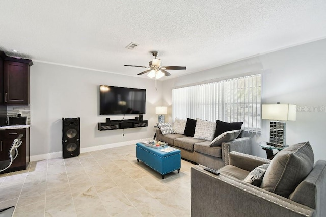 229 Temple Ave, Fern Park, FL 32730 - living area featuring a ceiling fan, a textured ceiling, and baseboards