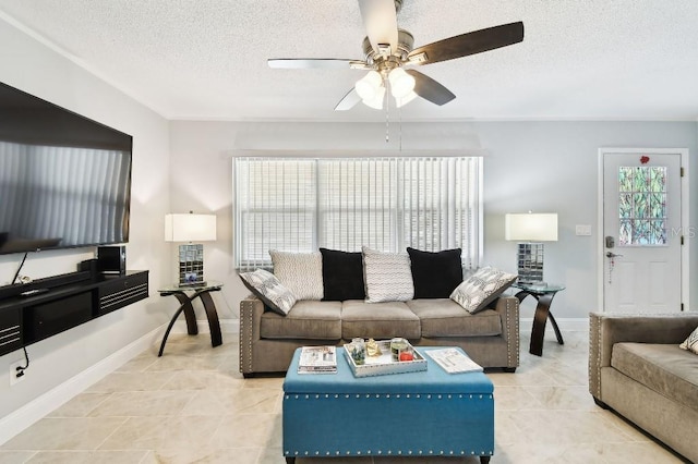 229 Temple Ave, Fern Park, FL 32730 - living room featuring ceiling fan, a textured ceiling, baseboards, and light tile patterned flooring
