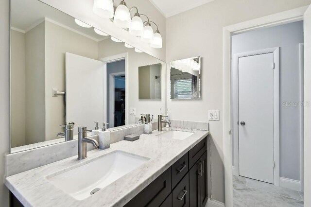 229 Temple Ave, Fern Park, FL 32730 - bathroom with double vanity, baseboards, and ornamental molding