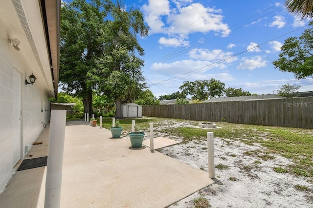 229 Temple Ave, Fern Park, FL 32730 - fenced backyard featuring a patio and an outdoor fire pit