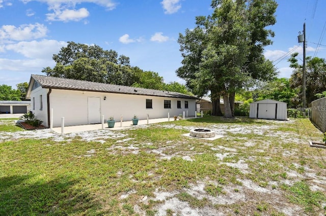 229 Temple Ave, Fern Park, FL 32730 - rear view of house with an outdoor fire pit, stucco siding, and a patio area