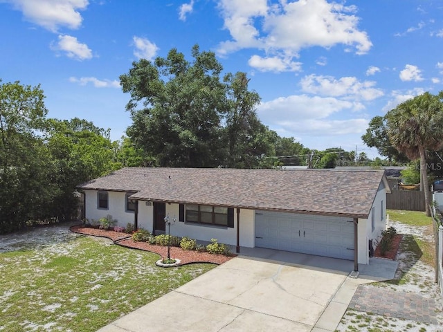 229 Temple Ave, Fern Park, FL 32730 - ranch-style home with a garage and concrete driveway
