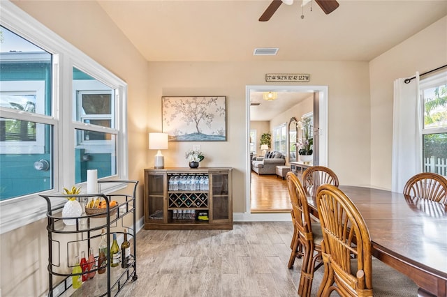 2709 Upton St S, Gulfport, FL 33711 - dining area with ceiling fan, wood finished floors, and baseboards