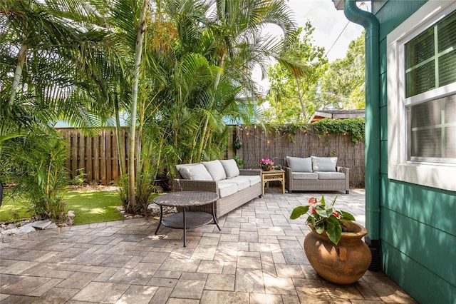 2709 Upton St S, Gulfport, FL 33711 - fenced backyard featuring an outdoor hangout area and a patio