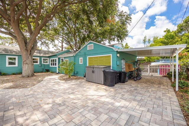 2709 Upton St S, Gulfport, FL 33711 - view of front facade with a garage