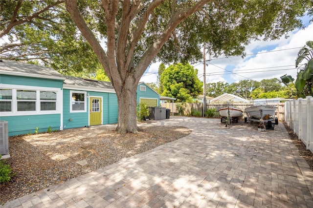2709 Upton St S, Gulfport, FL 33711 - fenced backyard featuring a patio and central AC unit