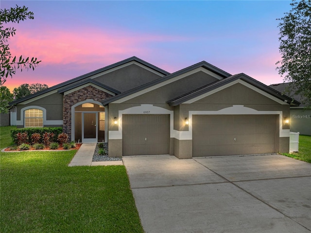 6957 Boulder Run Loop, Wesley Chapel, FL 33545 - single story home featuring stucco siding, stone siding, a garage, concrete driveway, and a front yard