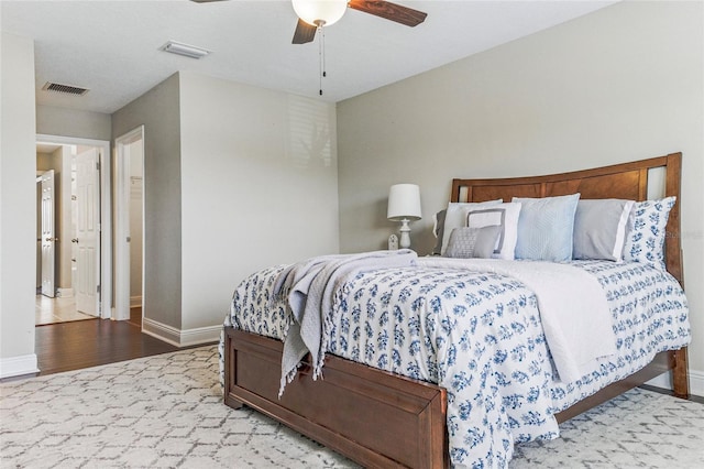 18696 Malinche Loop, Spring Hill, FL 34610 - bedroom with baseboards, wood finished floors, and ceiling fan