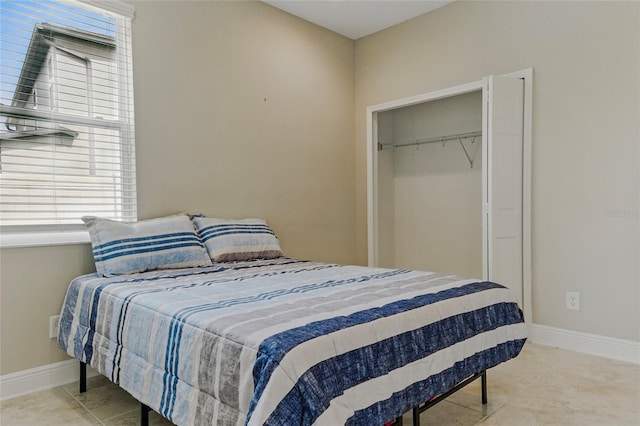 18696 Malinche Loop, Spring Hill, FL 34610 - tiled bedroom with baseboards and a closet