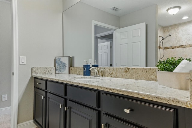 18696 Malinche Loop, Spring Hill, FL 34610 - full bath featuring vanity, baseboards, and a tile shower