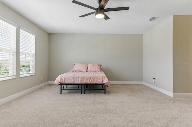 18696 Malinche Loop, Spring Hill, FL 34610 - carpeted bedroom featuring baseboards and ceiling fan