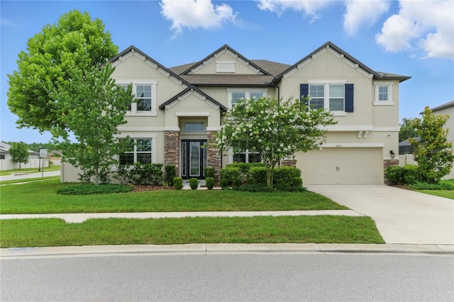18696 Malinche Loop, Spring Hill, FL 34610 - craftsman house with stone siding, stucco siding, driveway, and a garage