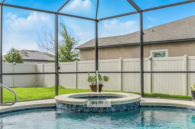 18696 Malinche Loop, Spring Hill, FL 34610 - view of pool featuring a fenced backyard, a pool with connected hot tub, and a lanai