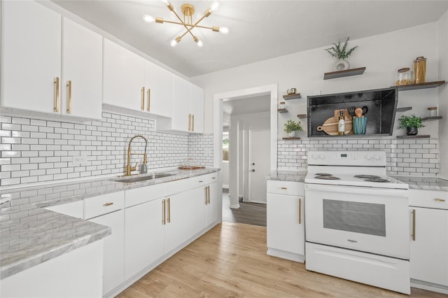 5622 Tangerine Ave S, Gulfport, FL 33707 - kitchen with white electric range, a sink, open shelves, and a chandelier