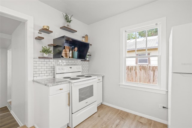 5622 Tangerine Ave S, Gulfport, FL 33707 - kitchen featuring white appliances, open shelves, light wood-type flooring, backsplash, and white cabinets
