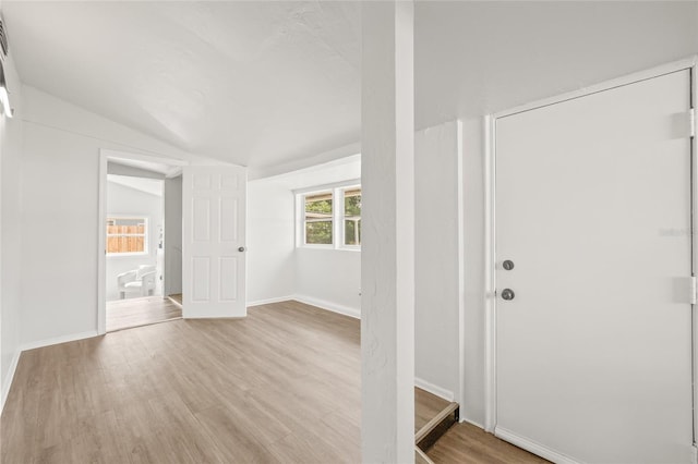 5622 Tangerine Ave S, Gulfport, FL 33707 - foyer featuring lofted ceiling, light wood-style floors, and baseboards