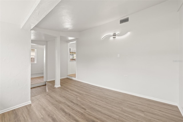 5622 Tangerine Ave S, Gulfport, FL 33707 - empty room with light wood-style flooring and baseboards