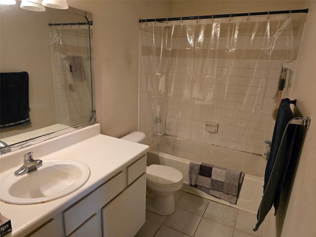 9100 Mlk St N Unit 503, Saint Petersburg, FL 33702 - full bath with toilet, tile patterned floors, vanity, shower / bath combo with shower curtain, and a textured wall