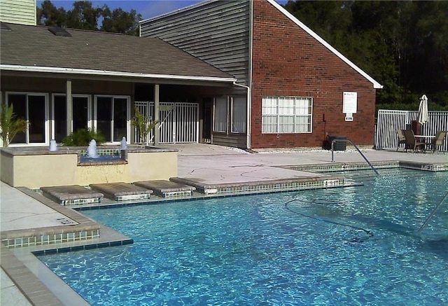 9100 Mlk St N Unit 503, Saint Petersburg, FL 33702 - community pool featuring a patio