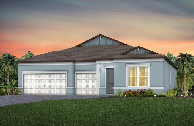 1576 Valier Pt, Zephyrhills, FL 33541 - view of front of home featuring a garage, a lawn, decorative driveway, and stucco siding