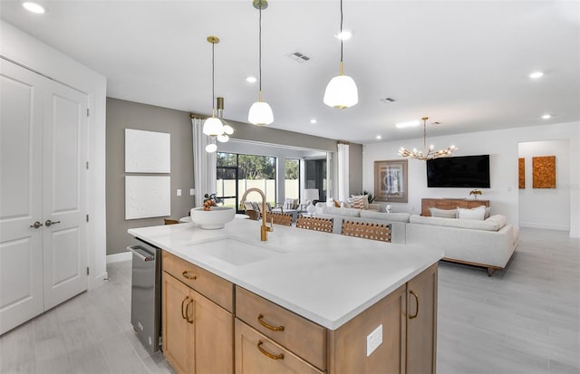 1576 Valier Pt, Zephyrhills, FL 33541 - kitchen featuring recessed lighting, light countertops, pendant lighting, a chandelier, and open floor plan