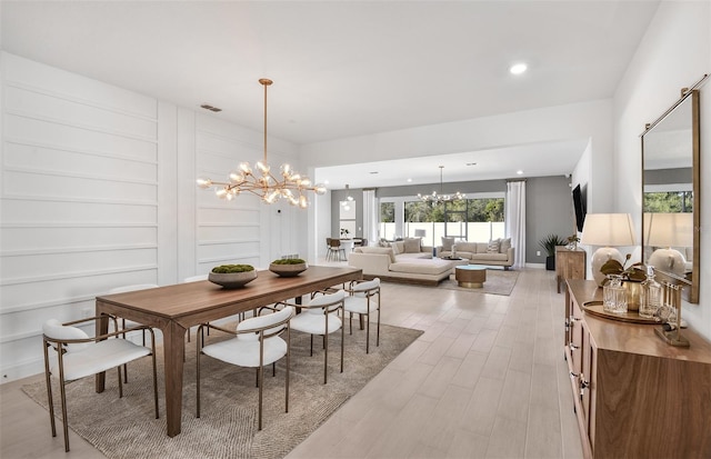 1576 Valier Pt, Zephyrhills, FL 33541 - dining area featuring a chandelier, light wood-style flooring, and recessed lighting