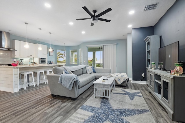 6416 Grenada Island Ave, Apollo Beach, FL 33572 - living room featuring dark wood finished floors, a ceiling fan, recessed lighting, and baseboards