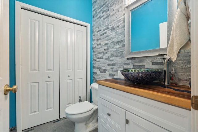 6416 Grenada Island Ave, Apollo Beach, FL 33572 - bathroom with a closet, vanity, tile patterned flooring, and toilet