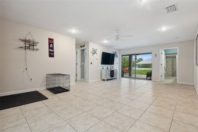 6416 Grenada Island Ave, Apollo Beach, FL 33572 - unfurnished living room with light tile patterned floors, a ceiling fan, baseboards, and recessed lighting
