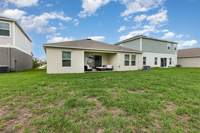 1368 Axel Cir, Winter Haven, FL 33880 - back of property with stucco siding, a yard, and a shingled roof