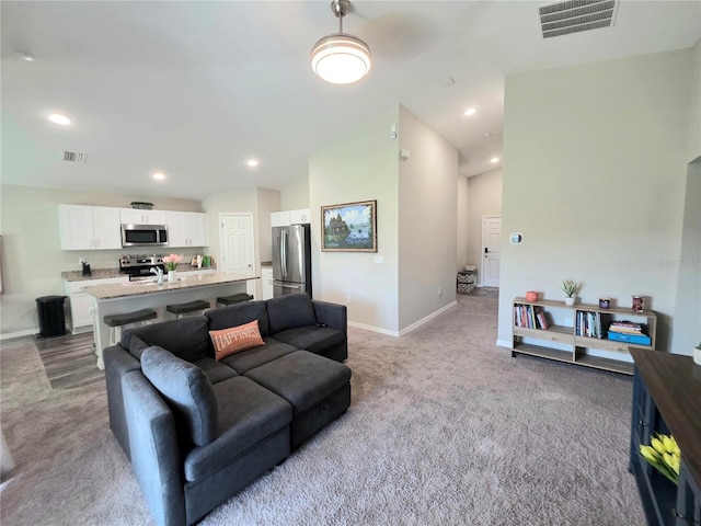 1368 Axel Cir, Winter Haven, FL 33880 - living area featuring light carpet and recessed lighting