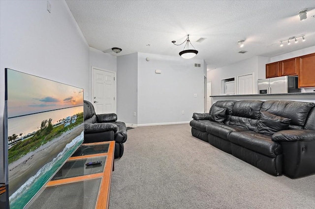 4998 Key Lime Dr Unit 103, Jacksonville, FL 32256 - carpeted living area featuring a textured ceiling and baseboards