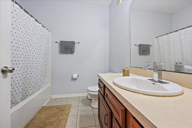 4998 Key Lime Dr Unit 103, Jacksonville, FL 32256 - bathroom featuring vanity, tile patterned flooring, toilet, baseboards, and shower / bath combo with shower curtain