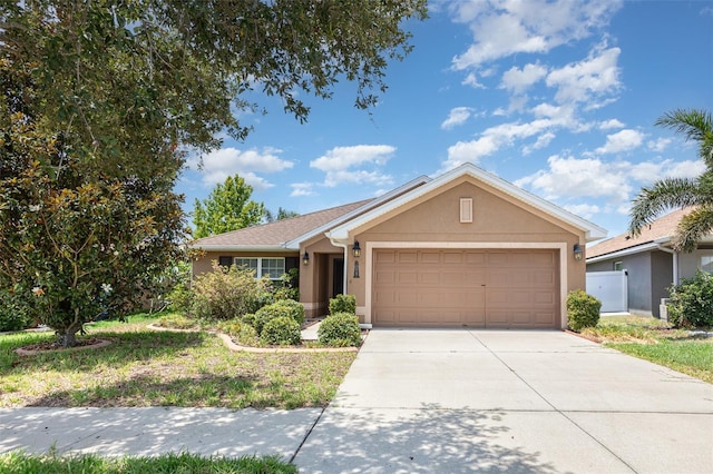10847 Kirkwall Port Dr, Wimauma, FL 33598 - ranch-style home featuring a garage, stucco siding, and driveway