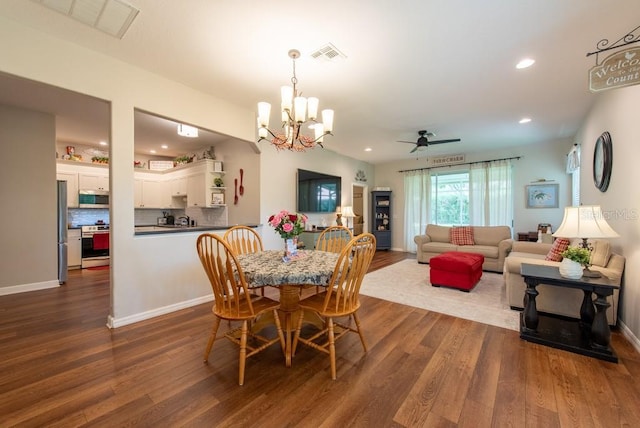 4228 Silver Star Dr, Spring Hill, FL 34609 - dining area featuring dark wood finished floors, a chandelier, recessed lighting, a ceiling fan, and baseboards
