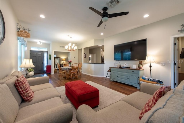 4228 Silver Star Dr, Spring Hill, FL 34609 - living area featuring a chandelier, ceiling fan, dark wood-style floors, recessed lighting, and baseboards