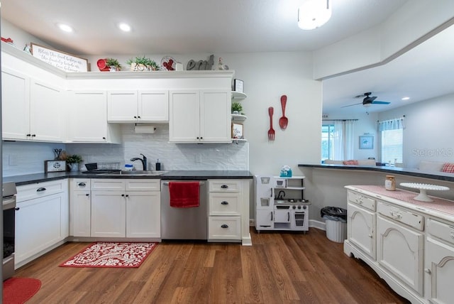 4228 Silver Star Dr, Spring Hill, FL 34609 - kitchen featuring stainless steel dishwasher, a sink, dark wood finished floors, white cabinets, and backsplash