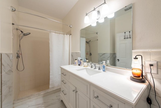 4228 Silver Star Dr, Spring Hill, FL 34609 - full bath featuring a shower with shower curtain, marble finish flooring, vanity, and a wainscoted wall