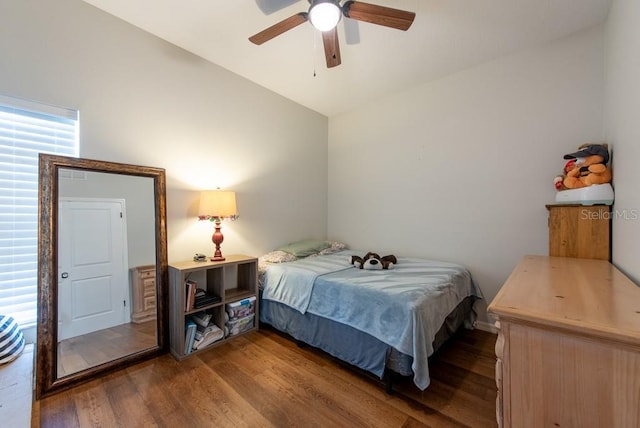 4228 Silver Star Dr, Spring Hill, FL 34609 - bedroom with dark wood-type flooring, lofted ceiling, and a ceiling fan