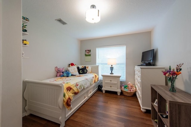 4228 Silver Star Dr, Spring Hill, FL 34609 - bedroom with dark wood-style flooring