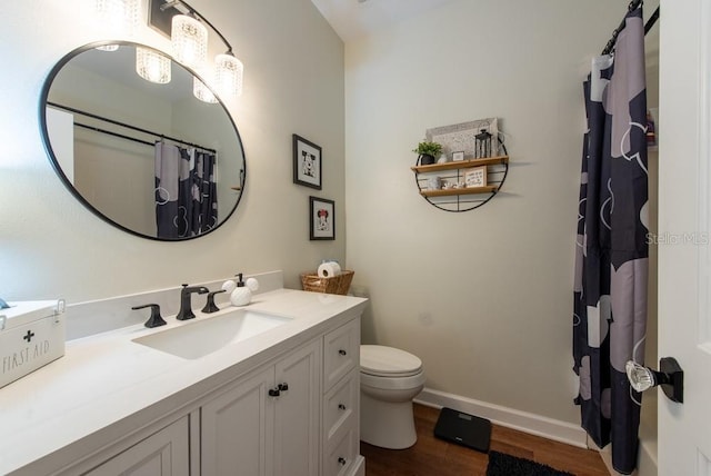 4228 Silver Star Dr, Spring Hill, FL 34609 - bathroom featuring vanity, wood finished floors, toilet, a shower with curtain, and baseboards