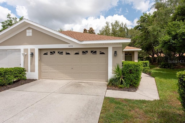 4228 Silver Star Dr, Spring Hill, FL 34609 - single story home with a garage, stucco siding, driveway, and a front lawn