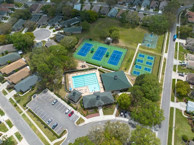 4228 Silver Star Dr, Spring Hill, FL 34609 - aerial overview of property's location with a pool area and nearby suburban area