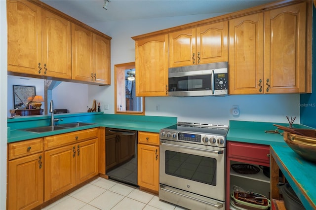 4783 Palermo Ct NE, Saint Petersburg, FL 33703 - kitchen featuring stainless steel appliances, a sink, light tile patterned floors, and brown cabinets