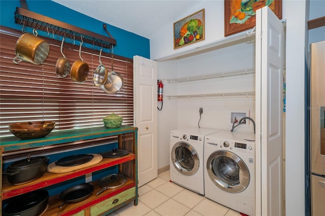 4783 Palermo Ct NE, Saint Petersburg, FL 33703 - washroom featuring washing machine and clothes dryer and light tile patterned floors